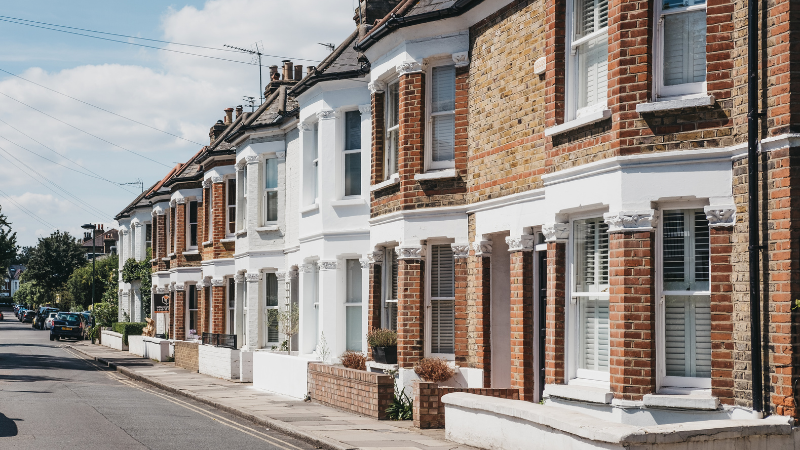 A street view of a row of classic British terraced houses, representing typical buy-to-let investment properties.