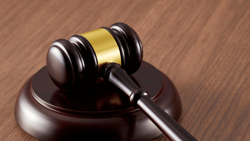 A close-up of an auctioneer's gavel, representing the rules and processes involved in the Modern Method of Auction for UK property.